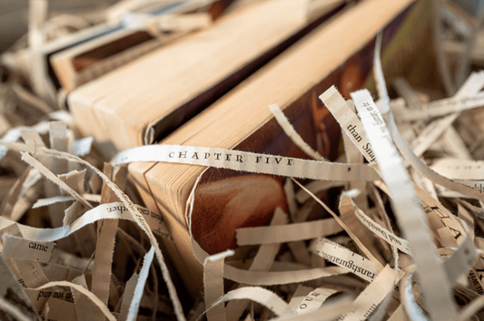 Recycled Harry Potter book pages, repurposed as packaging material for candles.