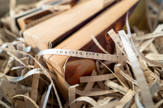 Recycled Harry Potter book pages, repurposed as packaging material for candles.
