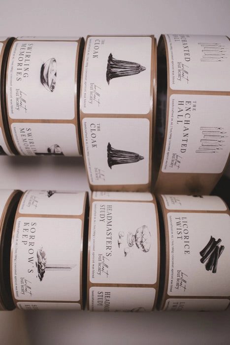 Close-up of handmade candle label rolls for bookish candles - Brilliant but Scary small batch production