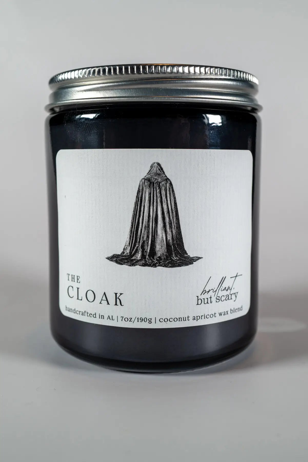 The Cloak bookish candle with silver lid and navy glass jar - Brilliant but Scary luxury candles