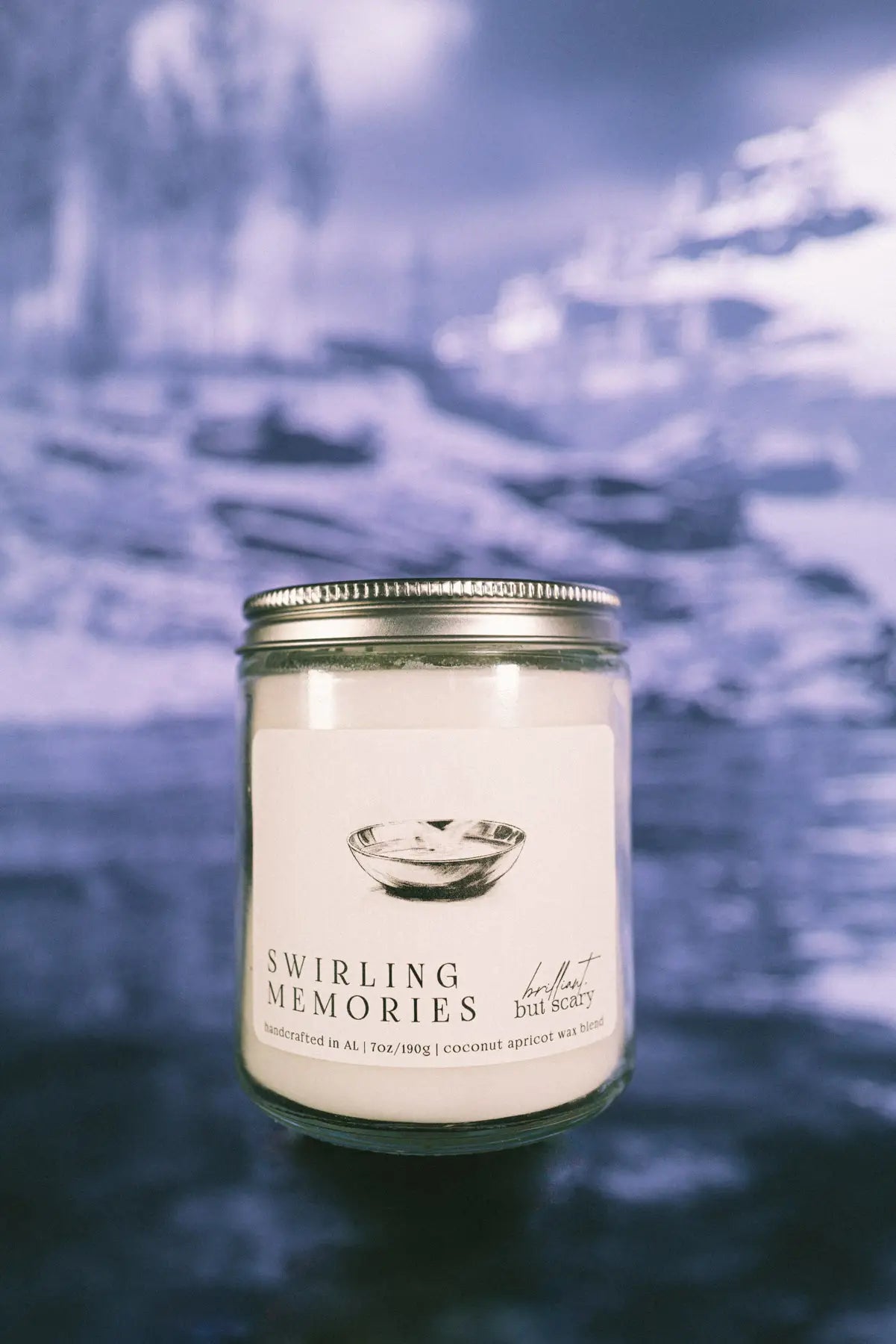 Swirling Memories fantasy candle in clear jar on dark winter lake - Brilliant but Scary