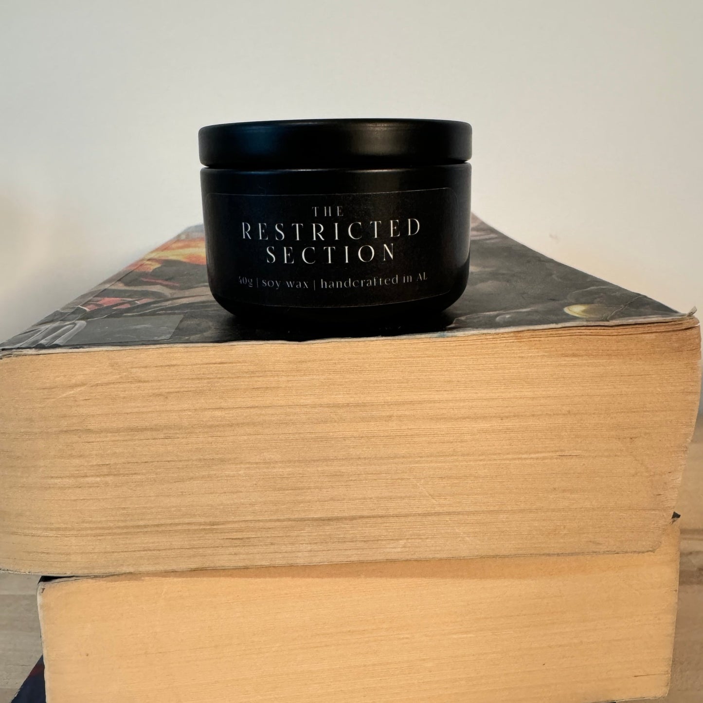 “The Restricted Section” small tin candle — a magical gift, perfect for Harry Potter fans and book lovers.